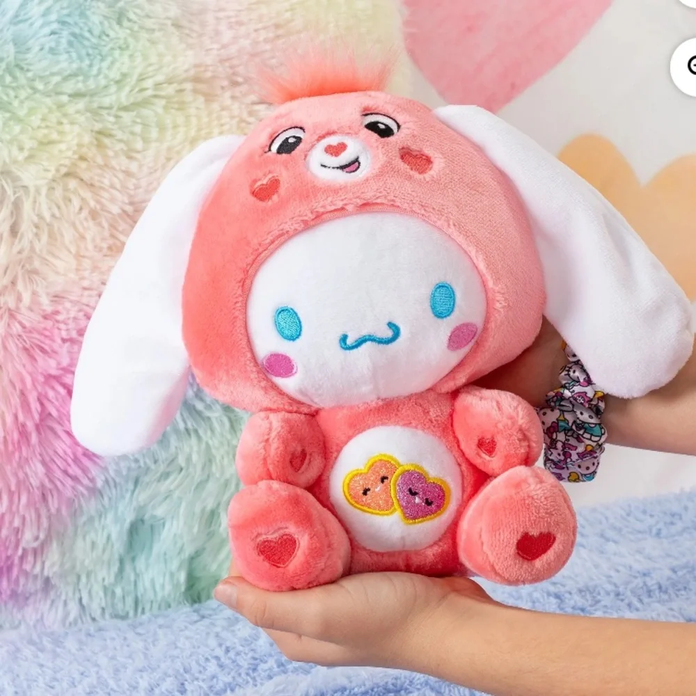 Hello Kitty Cinnamoroll plush dressed as Love-a-Lot Bear Care. Ear collaboration